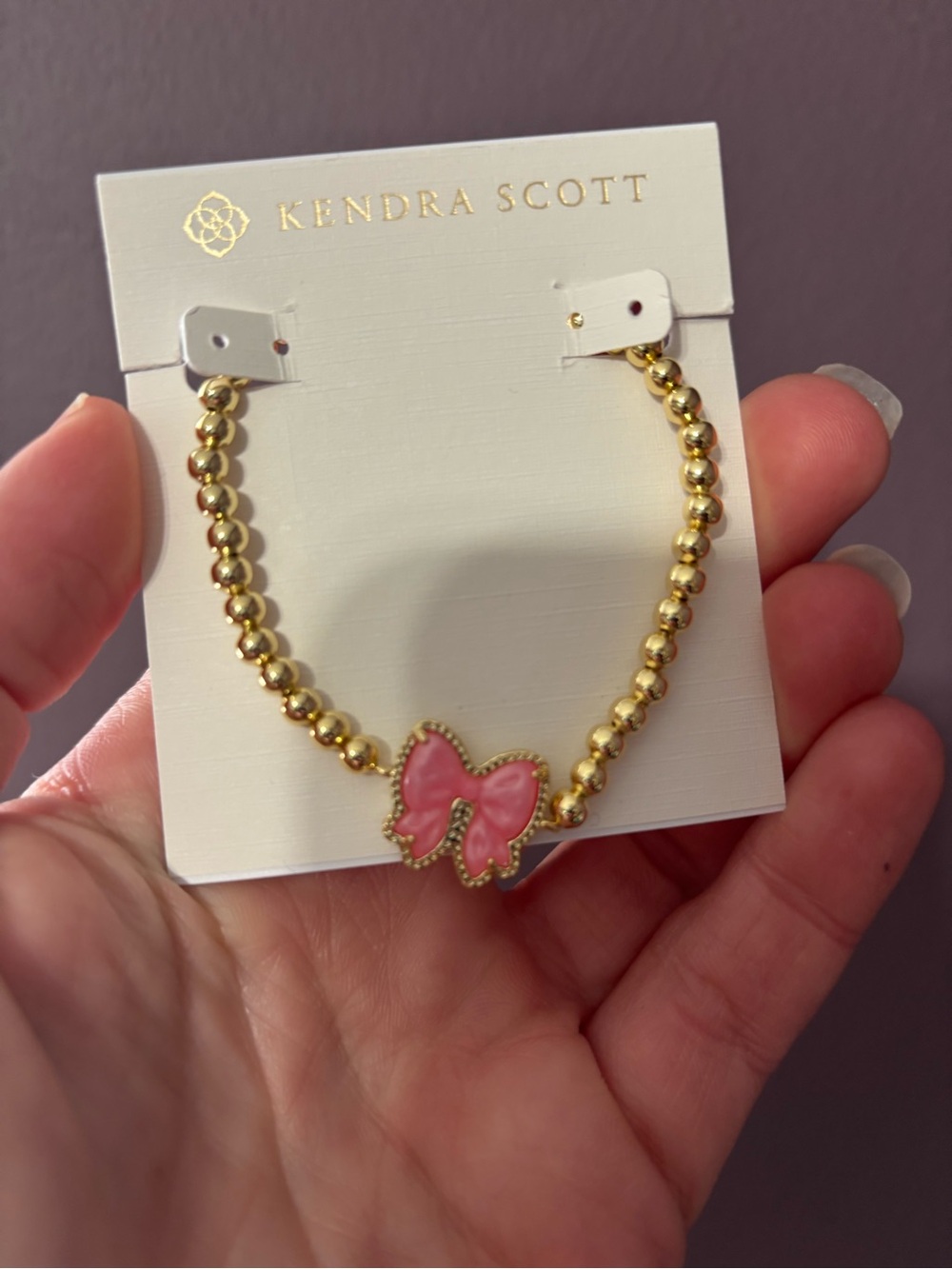 Kendra Scott  Gold Bead Bracelet with Pink Bow Charm